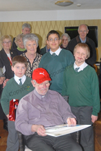Cropped image - St Patrick's pupils present a card to Father Harrington